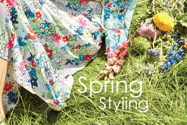 Spring styling header | Grass field and floral skirt | POM Amsterdam Campaign Image