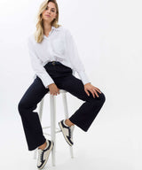 Vicki White Shirt | Brax at Sarah Thomson Melrose | Styled on model sat on chair