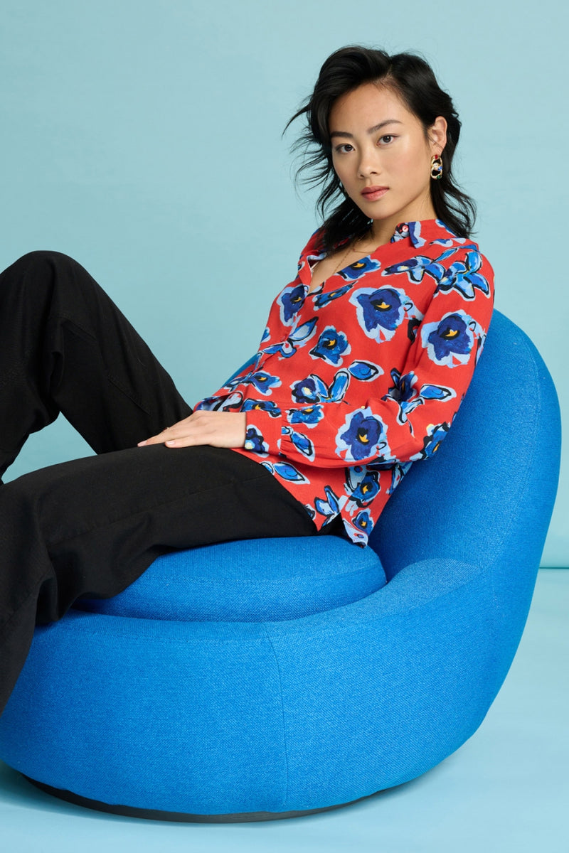 Red Mila Flower Glory Blouse | POM Amsterdam at Sarah Thomson | Model on chair