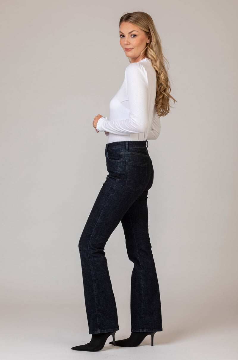 Mary Clean Dark Blue Denim Bootcut Jeans | Brax. at Sarah Thomson | Model side profile in jeans