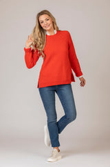 Round Neck Sweater in Lifebuoy Red | Fisherman Out of Ireland at Sarah Thomson | Styled on model with jeans
