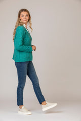 Alpaca Cardigan in Jade Green | Fisherman Out of Ireland at Sarah Thomson | Side profile on model