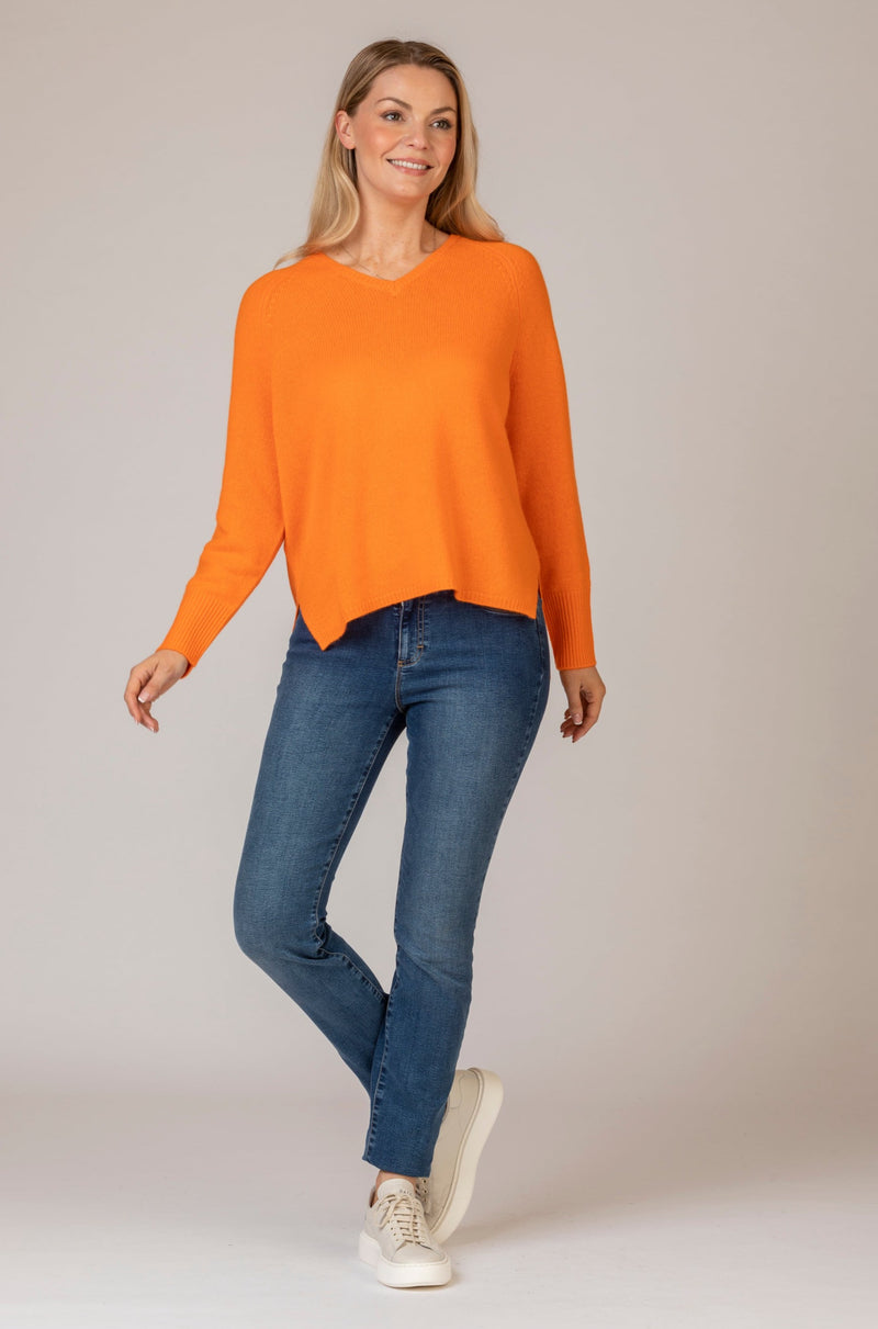 Relaxed Cashmere V-Neck Jumper in Orange | Esthēme Cachemire at Sarah Thomson | Styled with Brax jeans