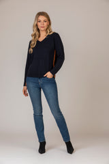 Cashmere V-Neck Jumper with Contrast Stitching in Navy and Orange | Estheme Cashmere at Sarah Thomson Melrose | Styled with Brax Jeans