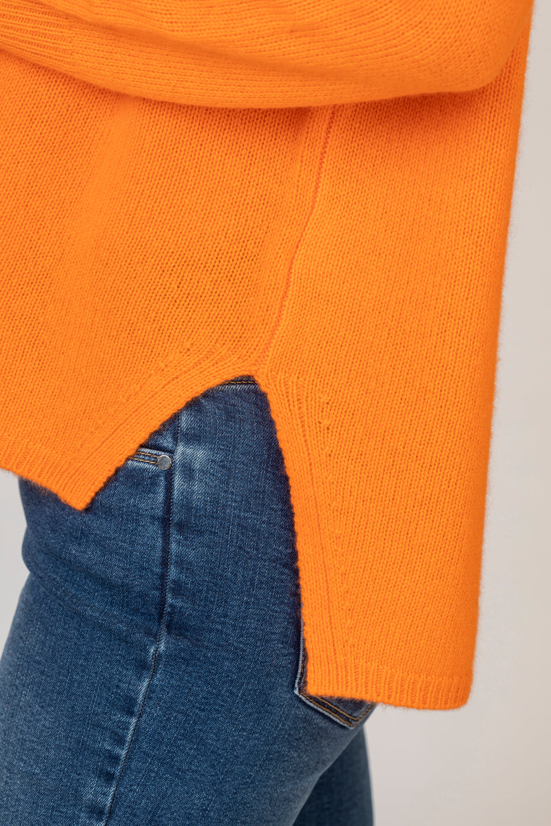Relaxed Cashmere V-Neck Jumper in Orange | Esthēme Cachemire at Sarah Thomson | Vent details