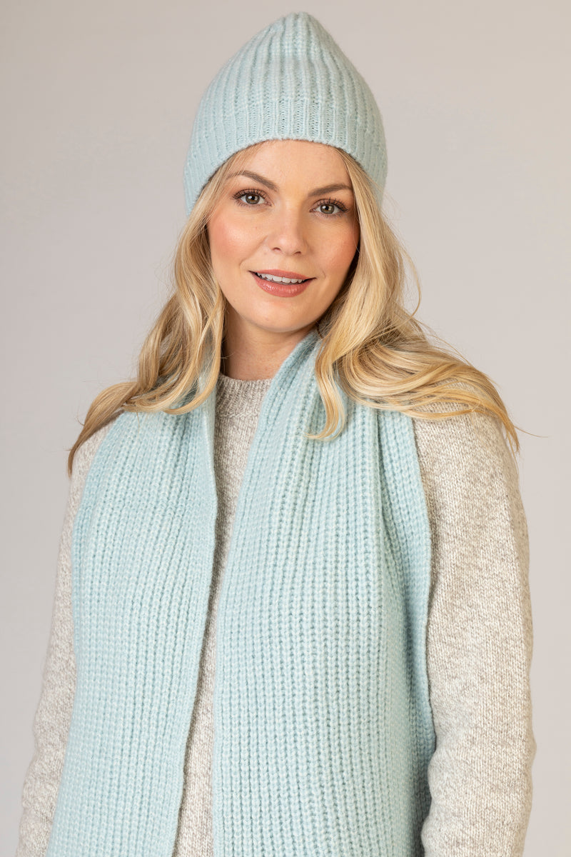 Baby Blue Ribbed Scarf | Fisherman Out of Ireland at Sarah Thomson | Model with matching hat | Close up profile