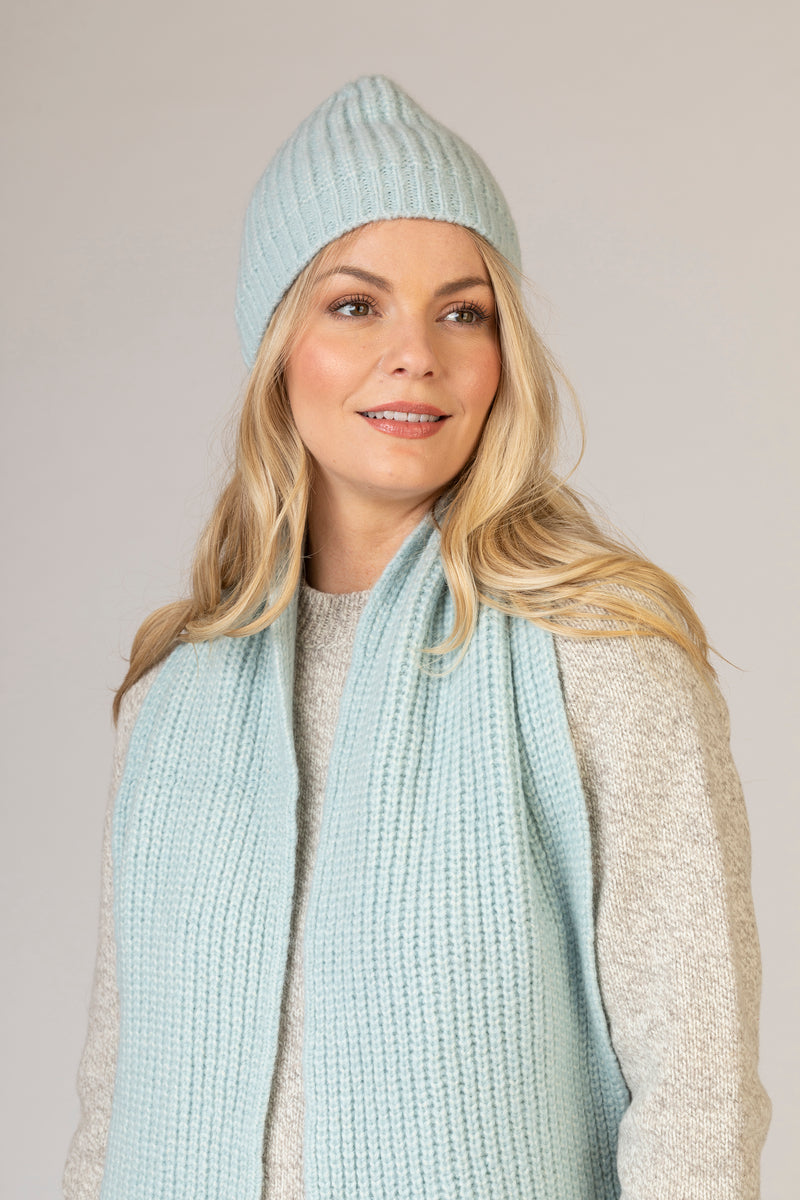 Baby Blue Ribbed Beanie | Fisherman Out of Ireland at Sarah Thomson | On model styled with scarf | Headshot style