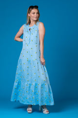The Lemon Maxi Linen Dress | Sartoria Saracena at Sarah Thomson | On model against blue backdrop